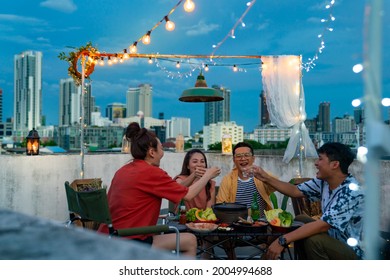 Group Of Diversity Asian Millennial People Friends Enjoy Outdoor Dinner Party With Eat Korean Food Barbecue Grill And Alcoholic Drink At Rooftop For Meeting Reunion And Holiday Celebration Together