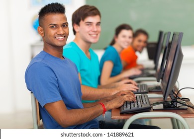 Group Of Diversity High School Students Using Computer In Classroom