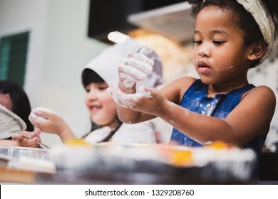 Group Diversity Kids Girl Making Cake Bakery In Kitchen