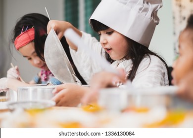 Group Diversity Kids Girl Making Cake Bakery In Kitchen