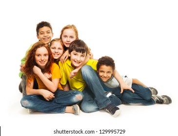 Group Of Diversity Looking Kids, Boys And Girls Sitting On The Floor, In White Background