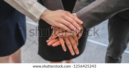 Group of diversity people hand stacked. Imply to their trusted in business teamwork and collaboration together.