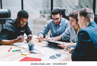 Group of diversity people searching information for provide ideas in new startup project using touch pad during brainstorming, collaboration and cooperation.Four colleagues sharing opinions at meeting - Shutterstock ID 1315381259