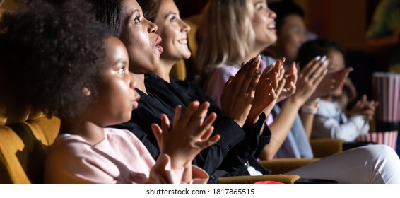 Group of diversity people watching movie in cinema theater with popcorn and drinks. Enjoy Happy laughing fun sad drama action movie concept. - Powered by Shutterstock