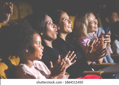 Group of diversity people watching movie in cinema theater with popcorn and drinks. Enjoy Happy laughing fun sad drama action movie concept. - Powered by Shutterstock