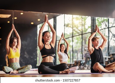 "Group of diversity practicing yoga class, healthy or Meditation Exercise,stretching in upward facing dog exercise, wearing sportswear bra and pants, sports and healthcare concept,
" - Powered by Shutterstock