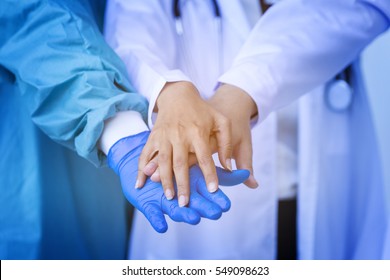 Group Of Doctor Worker Touching Hands Together, Agree On Partner, Partnership Of Medical Healthcare For Patients. And Delivery Good Of Service And Satisfaction For Mission Complete. Teamwork Concept
