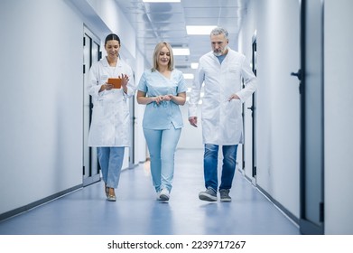 Group of doctors in the clinic corridor - Powered by Shutterstock
