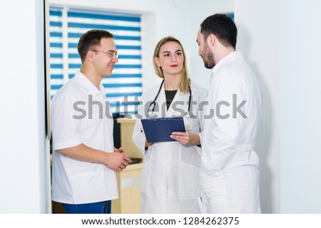 Group of doctors discussing and working together
