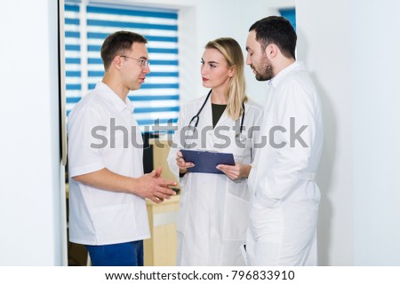 Group of doctors discussing and working together