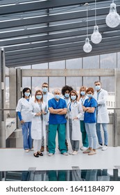 Group Of Doctors With Face Masks Looking At Camera, Corona Virus Concept.