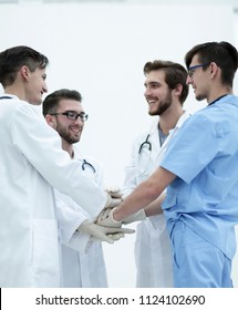Group Of Doctors Giving A High Five