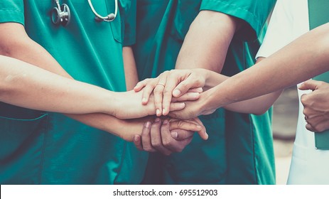 Group Of Doctors And Nurses Coordinate Hands For Trust. Concept Teamwork In Hospital 