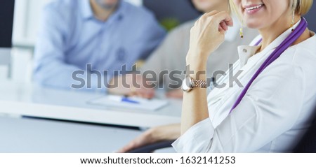 Group of doctors and nurses looking at X-ray