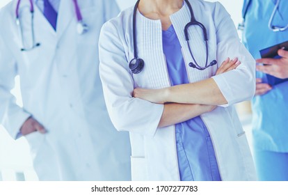 Group Of Doctors And Nurses Standing In The Hospital Room