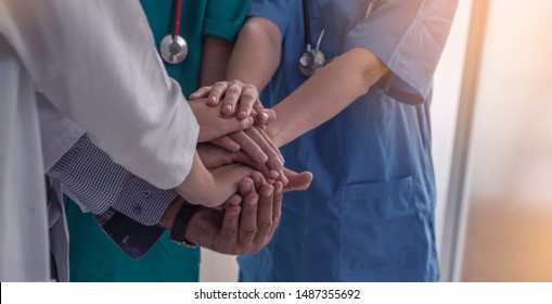 Group Of Doctors And Nurses Standing And Join Hand Together Staff In The Hospital,International, Profession, People And Medicine Concept 