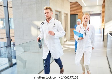 Group Doctors Are Walking Fast To An Emergency In The Hospital