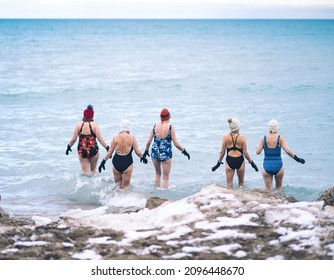 Group Of Elderly Woman Taking A Winter Swim In Lake Michigan