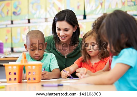 Group Of Elementary Age Children In Art Class With Teacher