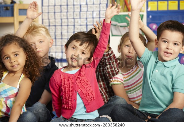 Group Elementary Age Schoolchildren Answering Question Stock Photo ...