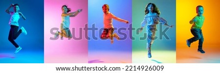 Group of elementary school and little kids or pupils jumping isolated in colorful on background in neon light. Creative collage. Back to school, education, childhood concept. Flyer for ad