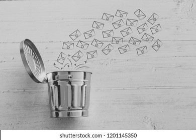 group of emails going into the bin, metaphor of spam or clearin up your inbox