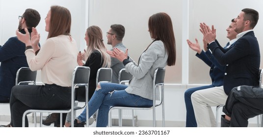 group of employees gives a standing ovation - Shutterstock ID 2363701167