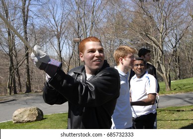 Group Of Employees Pulling A Rope As Part Of Team Building Activities At A Corporate Retreat, Westchester, New York,  April 14, 2016