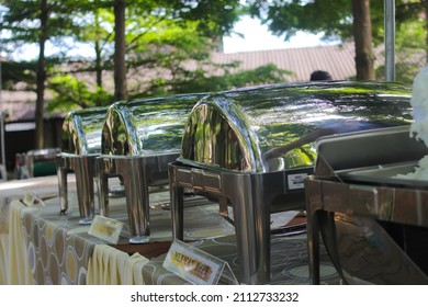 A Group Of Empty Buffets With Blurred Background Is Being Set Up For An Outdoor Wedding Concept. Catering And Garden Party Wedding Concept Background