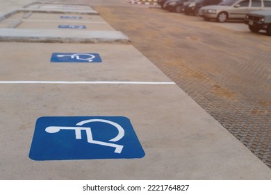 Group Of Empty Disable Person Parking Sign Or Wheelchair Symbol In The Parks With No People And Blurred Outdoors Background. Selective Focus And Copy Space. 