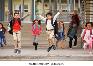 A Group Of Energetic Elementary School Kids Leaving School