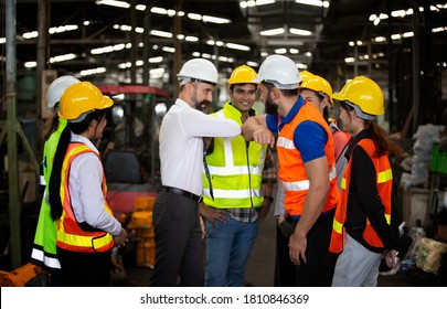 Group of Engineer manager and Factory Workers Team standing against production line. Teamwork concept. - Shutterstock ID 1810846369