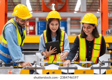 group of engineer technician foreman brainstorm planning to inspect and repair maintenance equipment of production machine, team of diverse workers working together at industrial manufacturing factory - Powered by Shutterstock