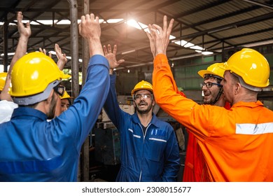 Group of Engineer Worker Team Cheerful Happy Greeting Celebrating Jobs Success Finished Hand Rising Together in Factory. - Powered by Shutterstock