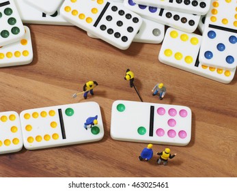 Group of engineer workers are making dominos