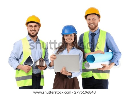 Group of engineers with gadgets and house model on white background