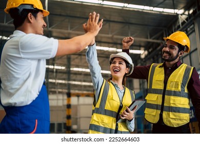 Group of engineers, industrial workers congratulation each other with high five gesture after success of meeting or finishing project in the factory.  - Shutterstock ID 2252664603