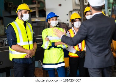Group of engineers Workers wear protective face masks for safety in machine industrial factory. Worker man wearing face mask prevent covid-19 virus and protective hard hat.  - Shutterstock ID 1814254007