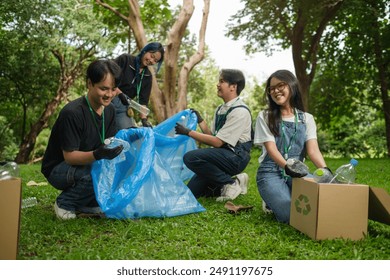 A group of enthusiastic young volunteers are seen actively participating in an environmental cleanup event in a park. - Powered by Shutterstock