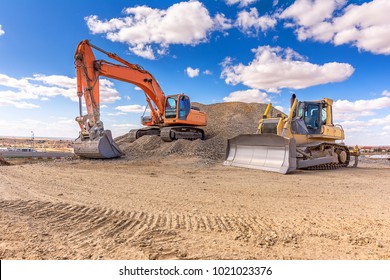 Group of excavator working on a construction site - Shutterstock ID 1021023376