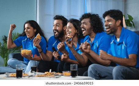 Group of excited Indian cricket fans celebrating by shouting for Team India win in cricket while watching tv at home - concept of cheering supporters, entertainment and championship match - Powered by Shutterstock