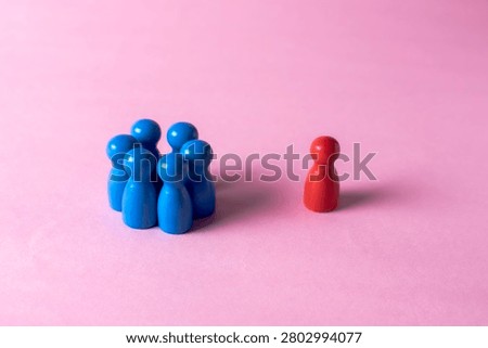 Group excluding one individual symbolizing discrimination, rejection and social isolation