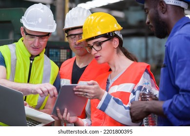 Group Of Factory Worker Working With Computer Laptop In Factory. Male And Female Worker Discussing And Training About Work At Factory.