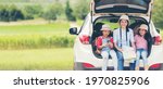 Group family children travel on car for adventure nature in vacations.  Asia people tourism checking map for explore natural destination and leisure trips travel for education.  Travel Concept