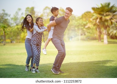 Group of family rekaxing at the park.  Vacation holiday of family . - Shutterstock ID 1112253872