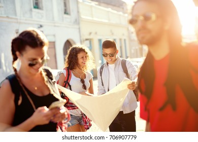 Group Of Fancy Tourists Are Having A Break In The City.