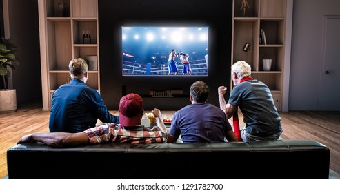 Group of fans are watching a boxing moment on the TV and celebrating a knockout, sitting on the couch in the living room. The living room is made in 3D.