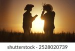 group farmers working wheat. agriculture business farm concept. silhouettes farmer work in wheat field. group of farmers silhouette man and woman sunset inspecting wheat working in the field