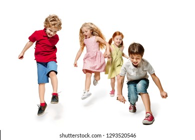 Group Of Fashion Cute Preschooler Kids Friends Running Together And Looking At Camera On A White Studio Background. Day Of Book, Education, School, Kid, Knowledge, Childhood, Friendship, Study And