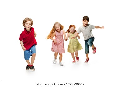 Group Of Fashion Cute Preschooler Kids Friends Running Together And Looking At Camera On A White Studio Background. Day Of Book, Education, School, Kid, Knowledge, Childhood, Friendship, Study And